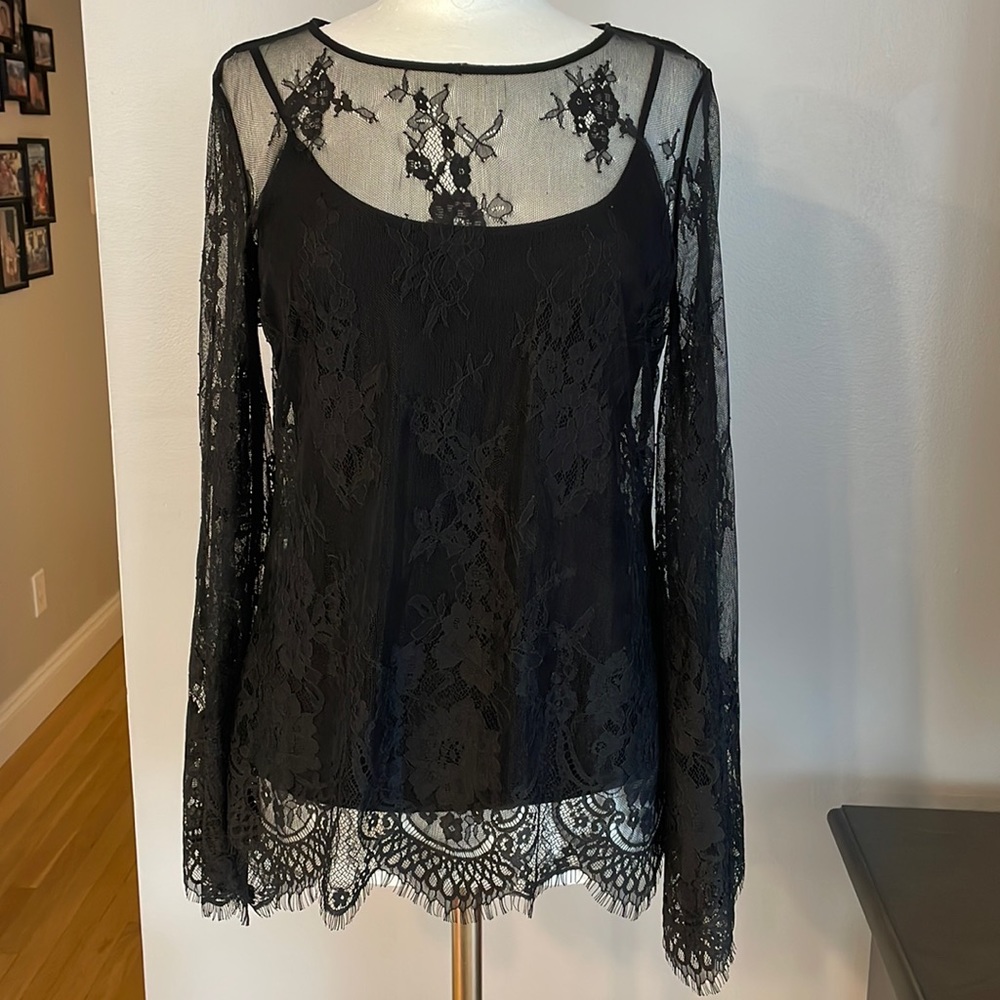 White House Black Market black blouse with lace overlay. Flowy sleeves.